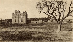 Early postcard of West Hall Farm, Belford. The hollow of the moat is visible round the building.
